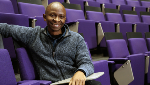 Andrew in an LSHTM lecture theatre.