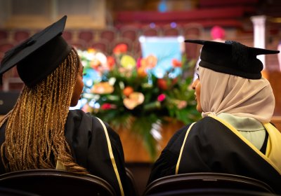 Graduates wearing graduation gowns