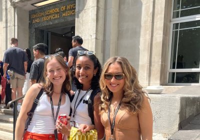 Group of four students standing on the steps outside LSHTM&#039;s Keppel Street building.