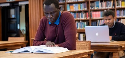 Student reading in library