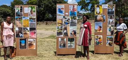 Mothers present photos documenting the impact of heat in their communities.